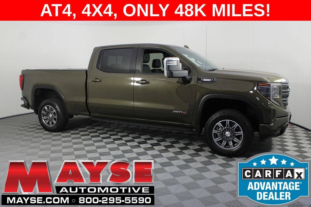 2024 GMC Sierra 1500 AT4 in Deep Bronze Metallic — front three-quarter view